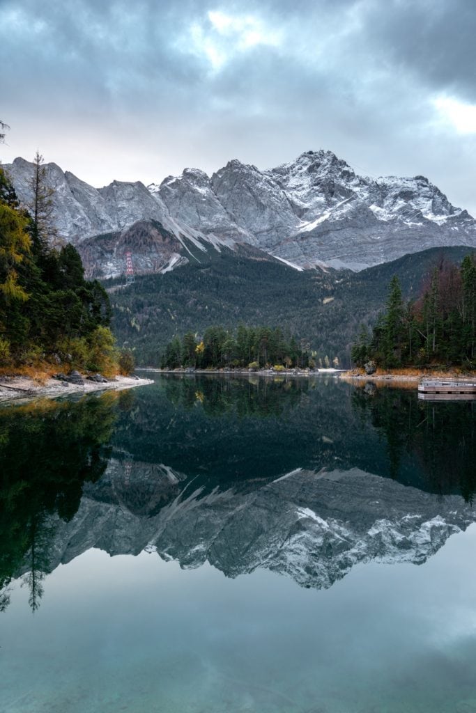 Mountains are reflected on the water surface of the Eibsee