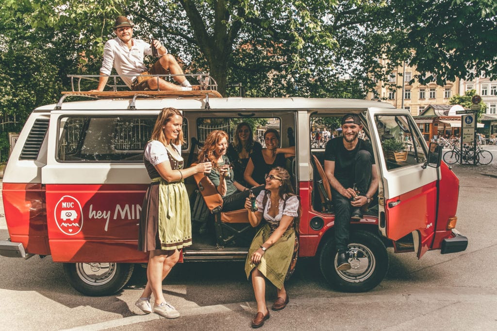 people at a VW bus from Hey Minga - a tour operator in Munich