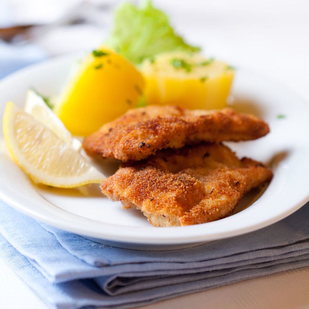 Wiener Schnitzel with potatoes on a plate