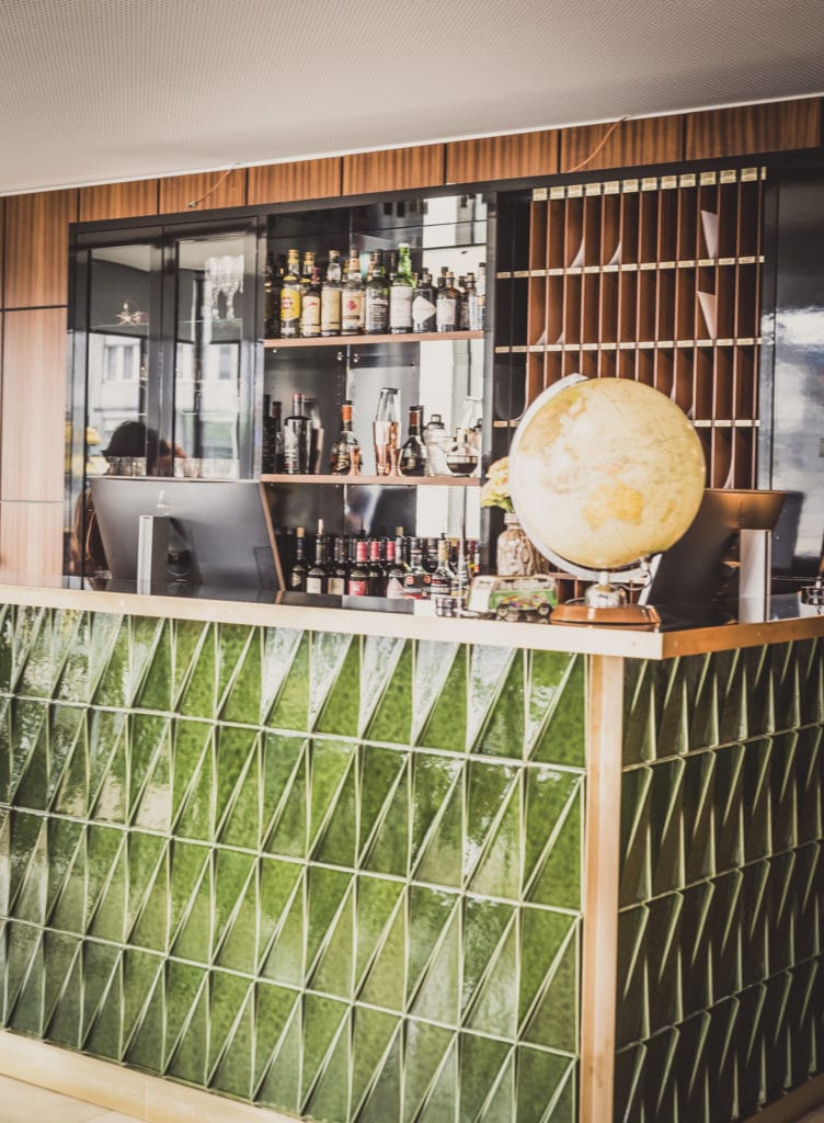 Quite retro: The reception in Hotel Henri is decorated with green tiles