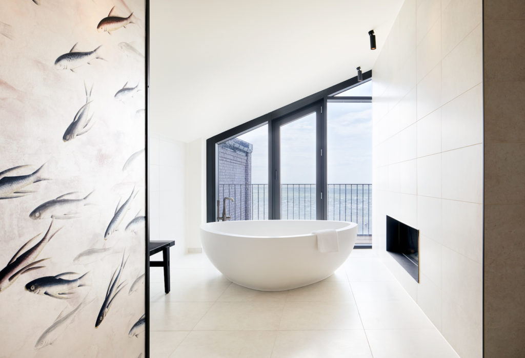 Bright bathroom in the Lighthouse Hotel with huge bathtub