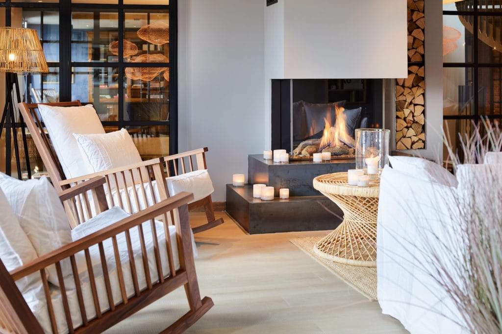 Chairs in front of the fireplace in the Ocean Spa