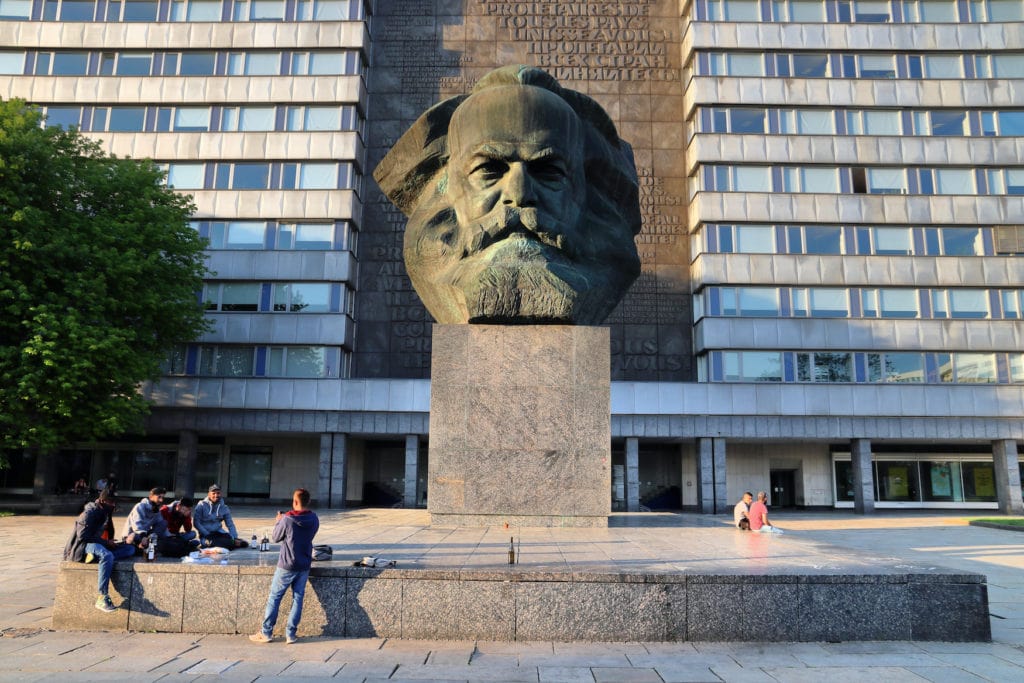 Young people in front of the huge Karl Marx monument in Chemnitz