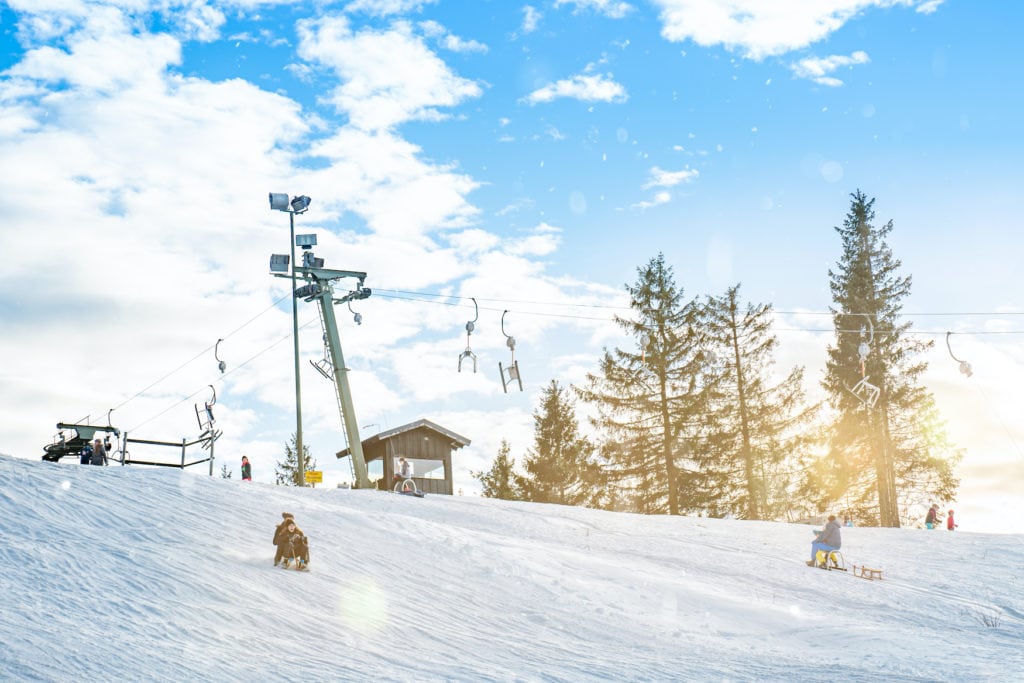 People go sledging on the Winterberg in the Sauerland