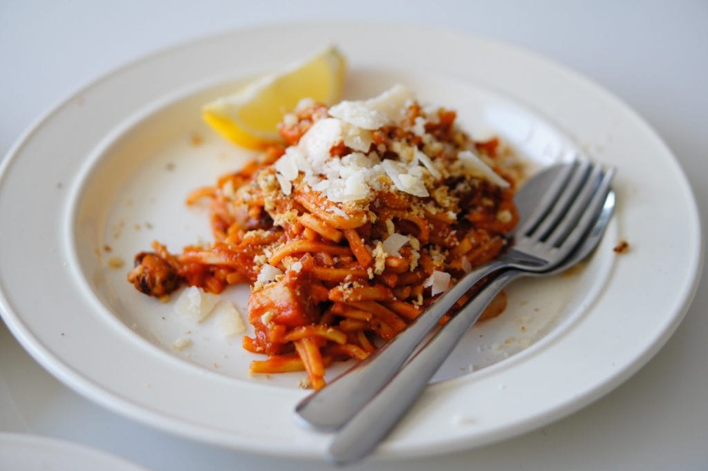 Knife and Fork placed on a plate with Pasta