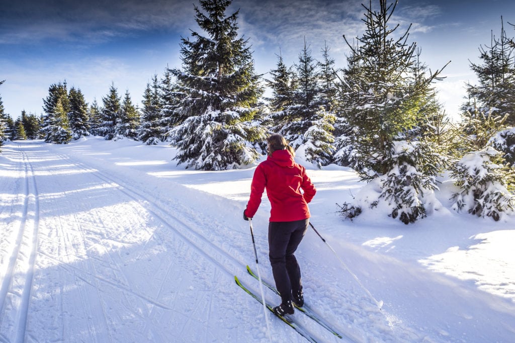 Woman cross country skiing in snow