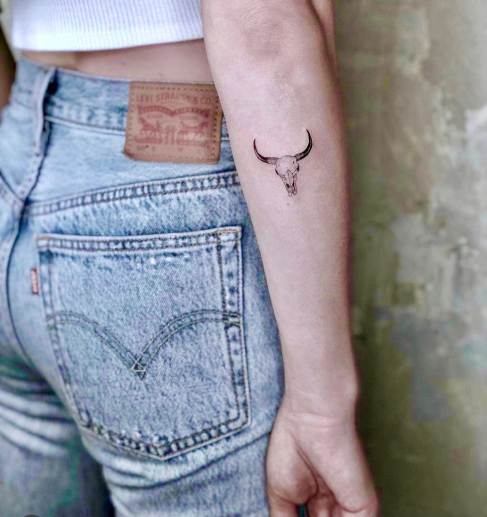 Woman got a tattoo in a tattoo studio in Munich