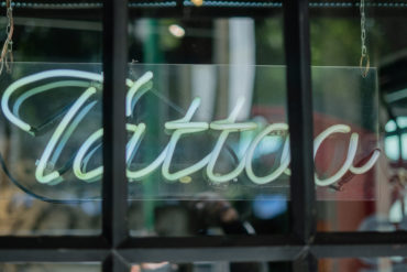 Tattoo neon sign in a tattoo studio in Germany