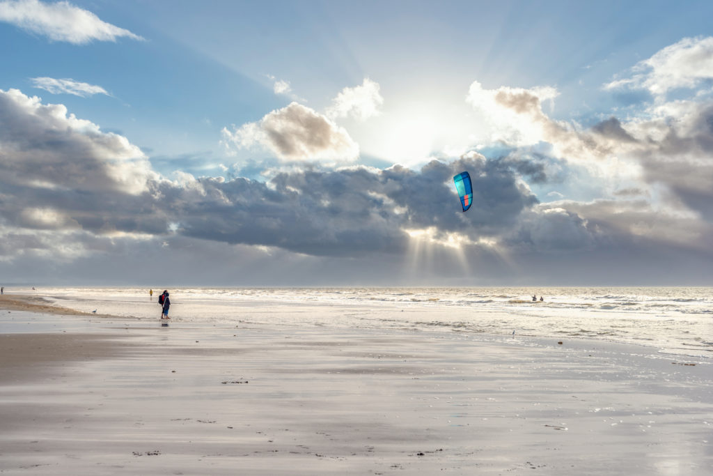 Kite surfers on the beach of St Peter-Ording in North Friesland in Germany