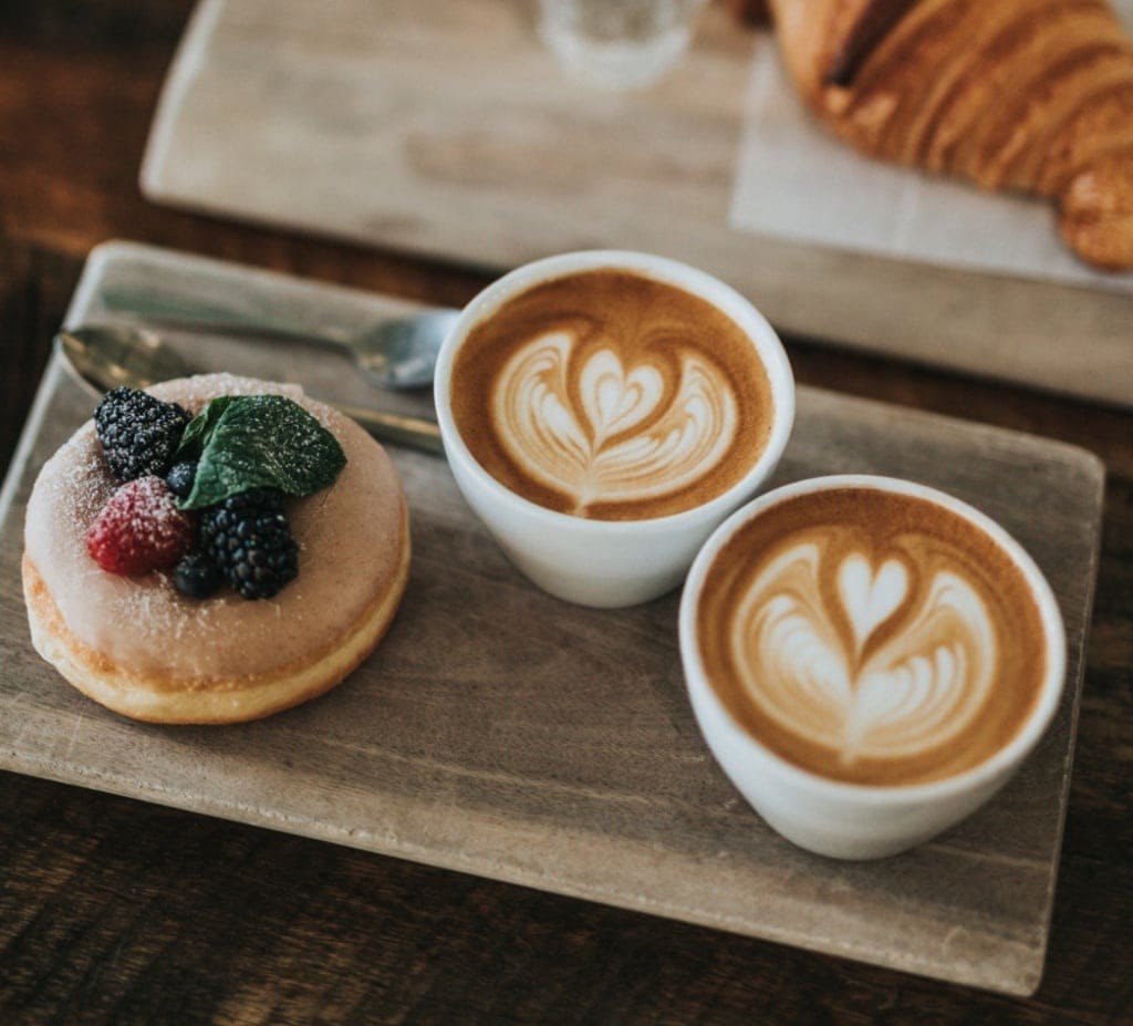 Two Cappuccinos and a sweet pastry