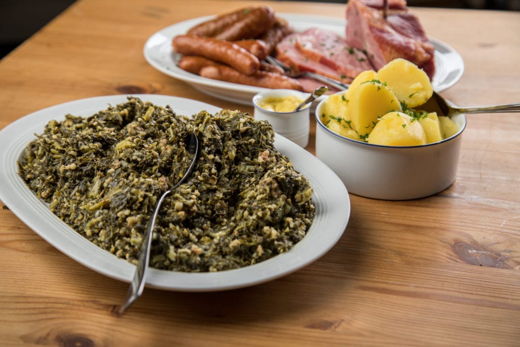 German kale dish served with meat and potatoes