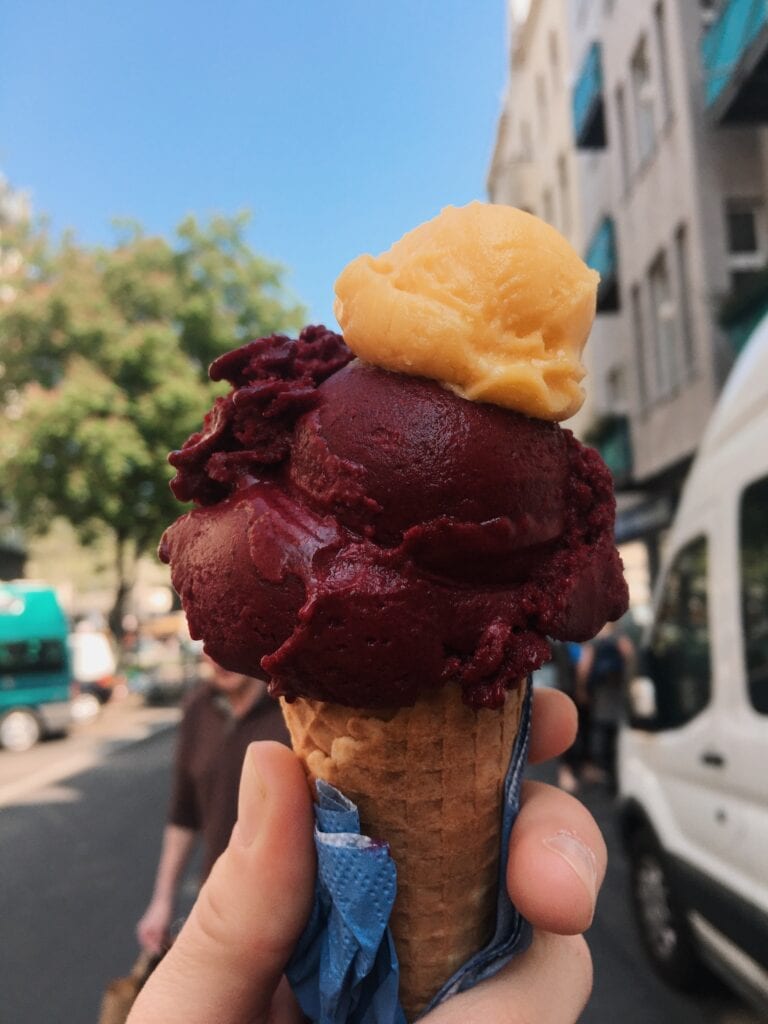 Woman is holding an ice cream cone