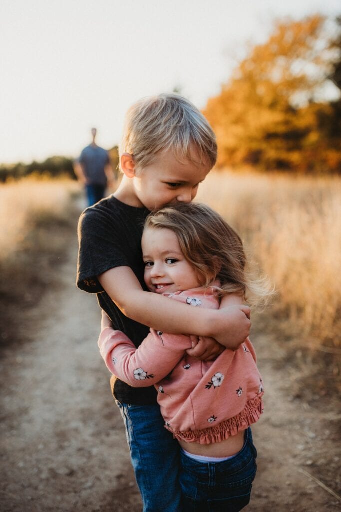 Brother and sister hugging each other