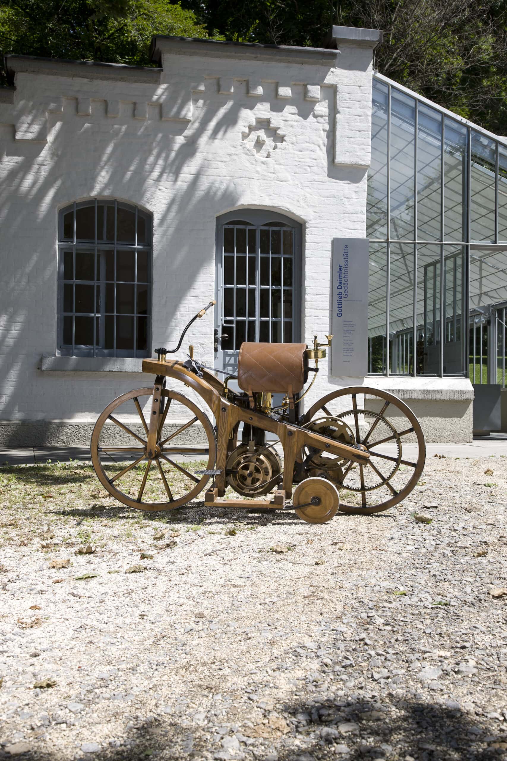 Replica of the riding car in front of the Gottlieb Daimler Memorial in Bad Cannstatt. In 1885, the riding car was built in this workshop as a test unit to prove the suitability of Gotllieb Daimler´s and Wilhelm Maybach´s gas or petroleum engine for everyday use. The riding car is the world´s first motorbike. Gottlieb Daimler applied for the patent on 29 August 1885.