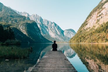 Traveler on a boat deck at Königssee lake in Bavaria