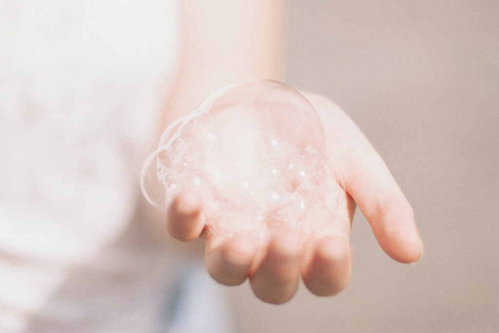 Woman lathers liquid shampoo in her hands, one of the German inventions