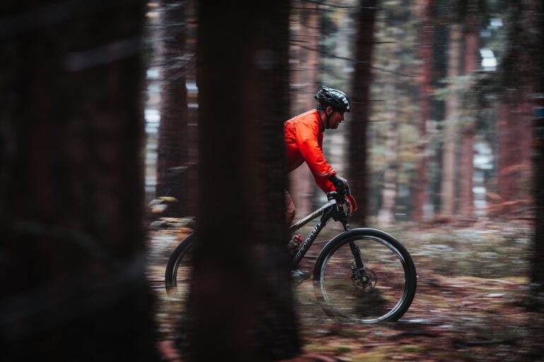 Man riding his bike through the Harz National Park near Braunlage