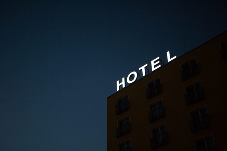 LED illuminated sign above hotel at night