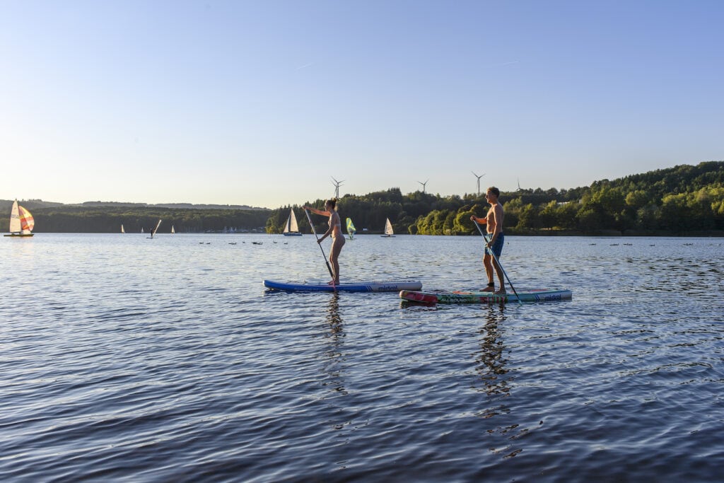 Stand-up paddling on the Lake Bostalsee in the Sankt Wendel County