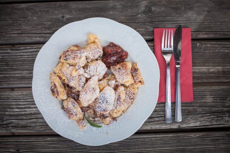 Discover Chiemgau culinary delights in the alpine huts, where local dishes such as Kaiserschmarren are served