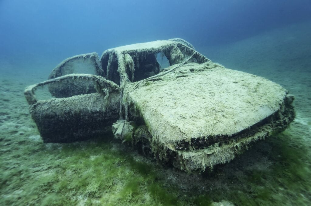 Car wreck in the chalk lake Hemmoor, one of the best spots for diving in Germany