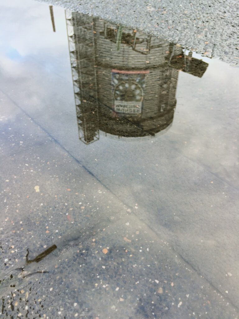 Gas boiler in Wuppertal reflected in a puddle