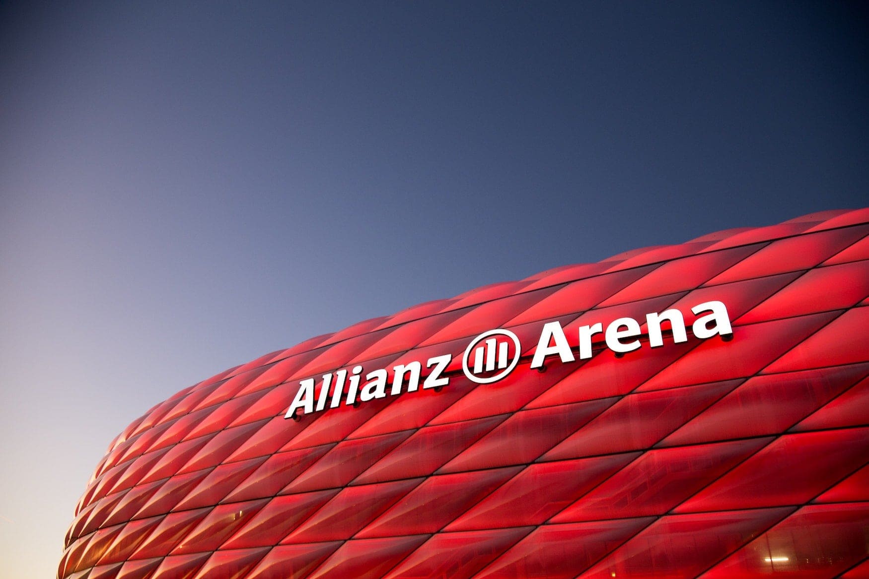 red luminous Allianz Arena designed by Herzog & de Meuron