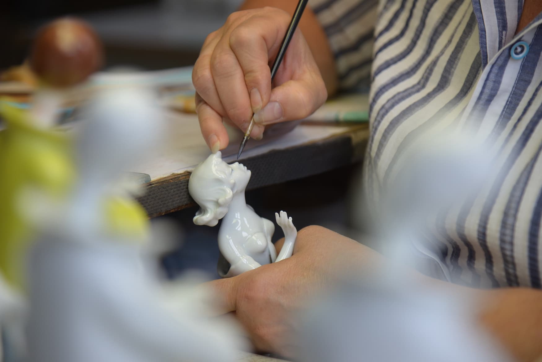 Ingrid Zacher paints porcelain figure