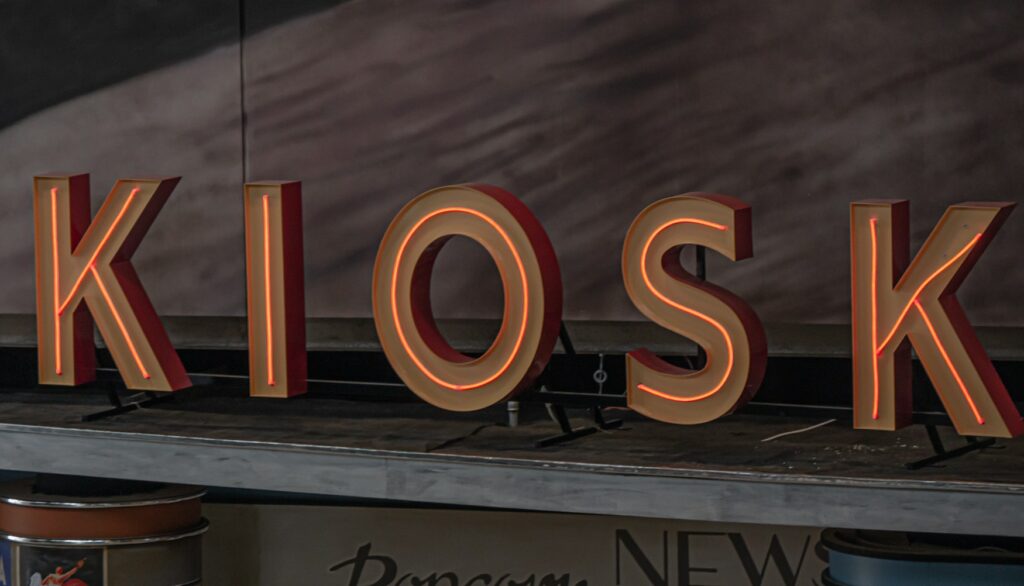 neon sign of kiosk