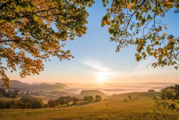 Panoramic view of an autumnal, misty valley in the Sauerland on the Rothaarsteig trail