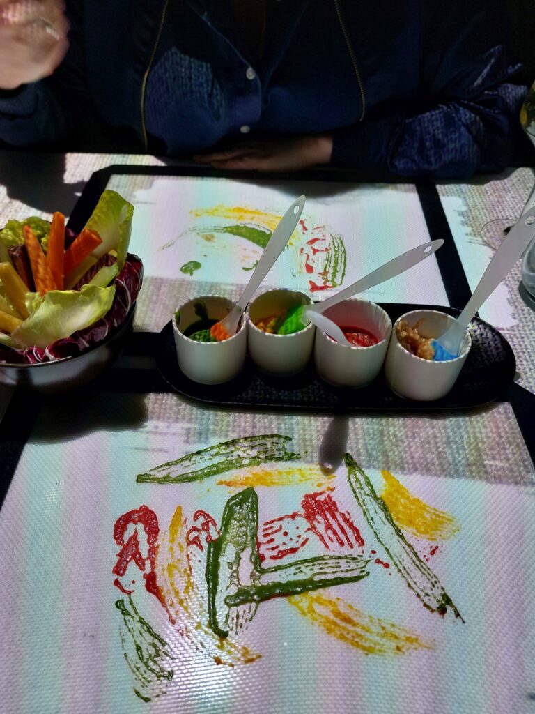 Several sauces were "painted" with brushes on a table mat