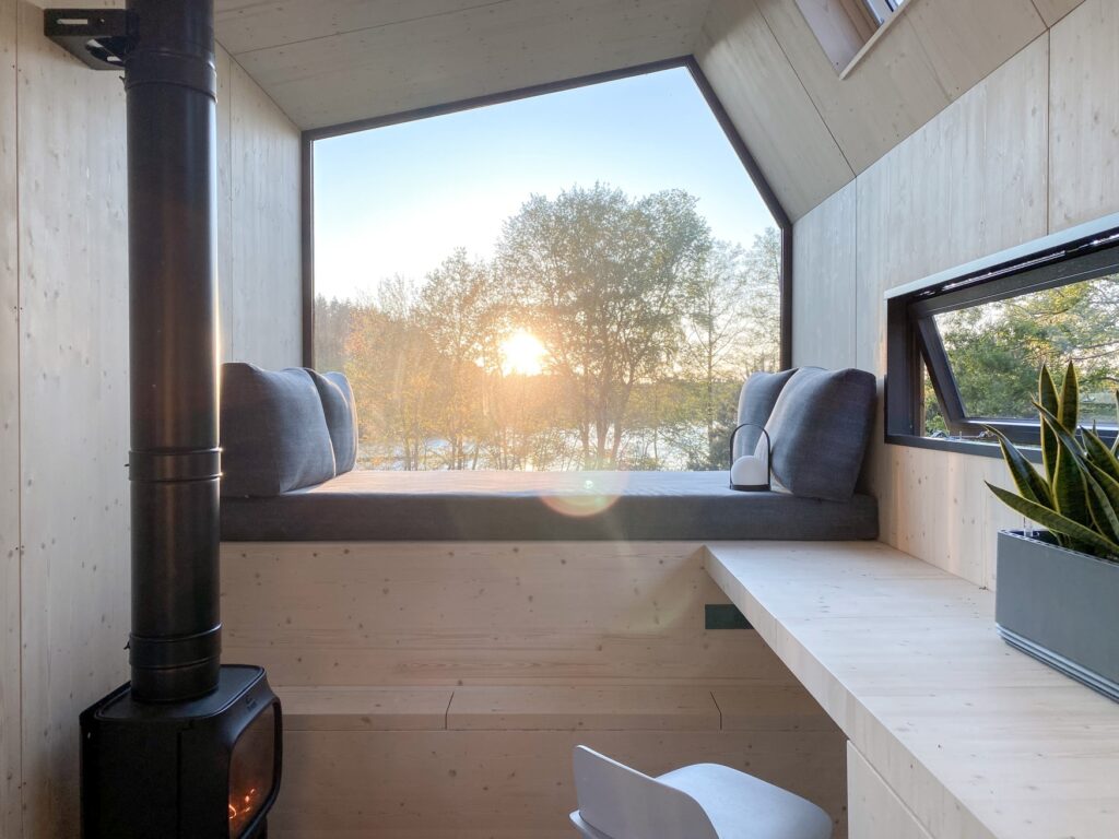 Interior of a Green Tiny House with large panoramic window