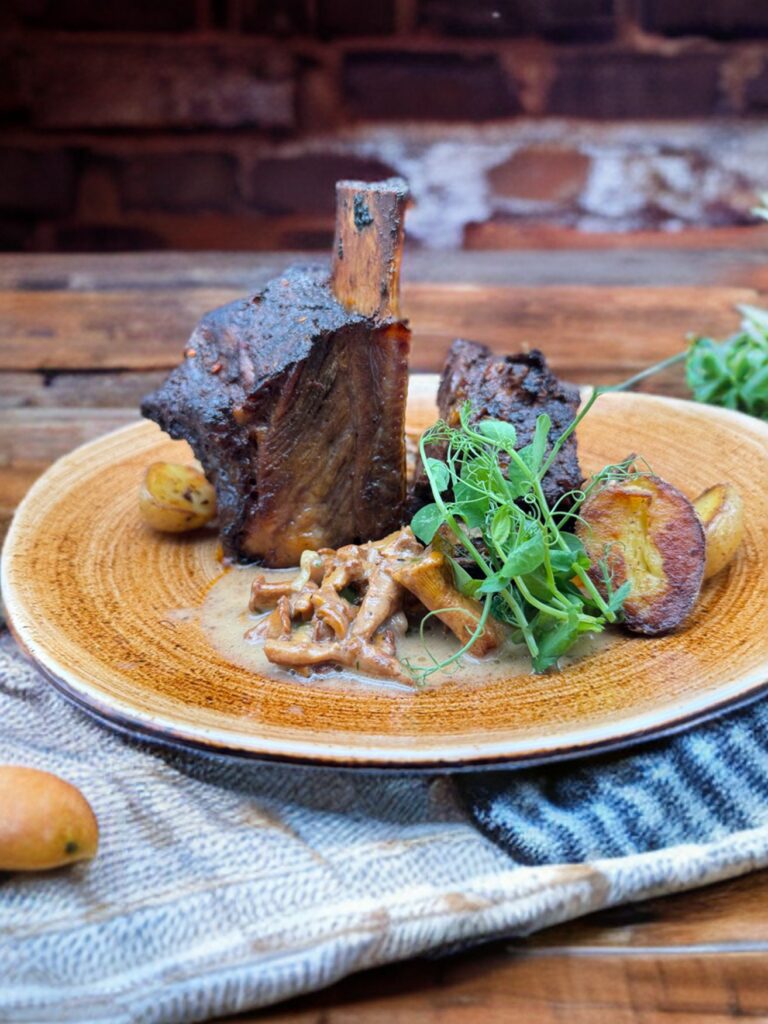 A braised beef cheek with fried chanterelles