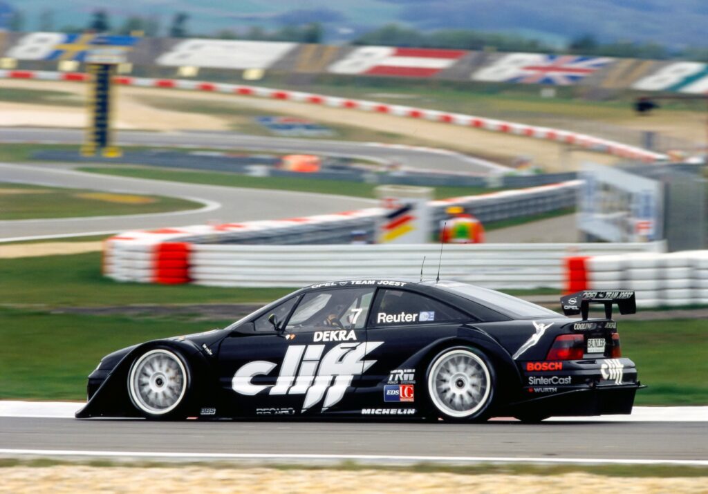 An Opel Calibra driving on a racetrack