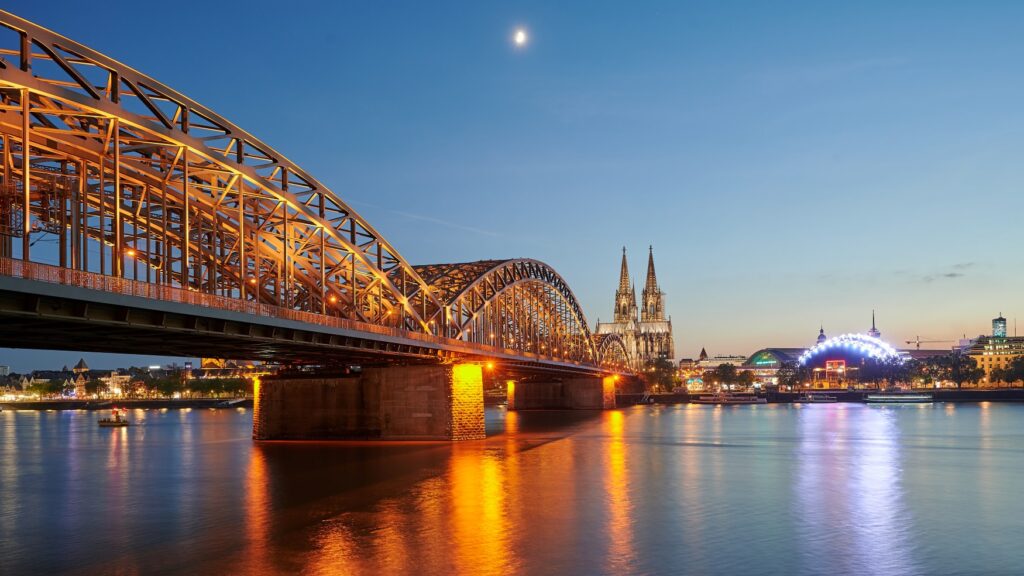 View of the Hohenzollern Bridge in Cologne as seen from Deutz. The cathedral and Musical Dome are clearly visible.