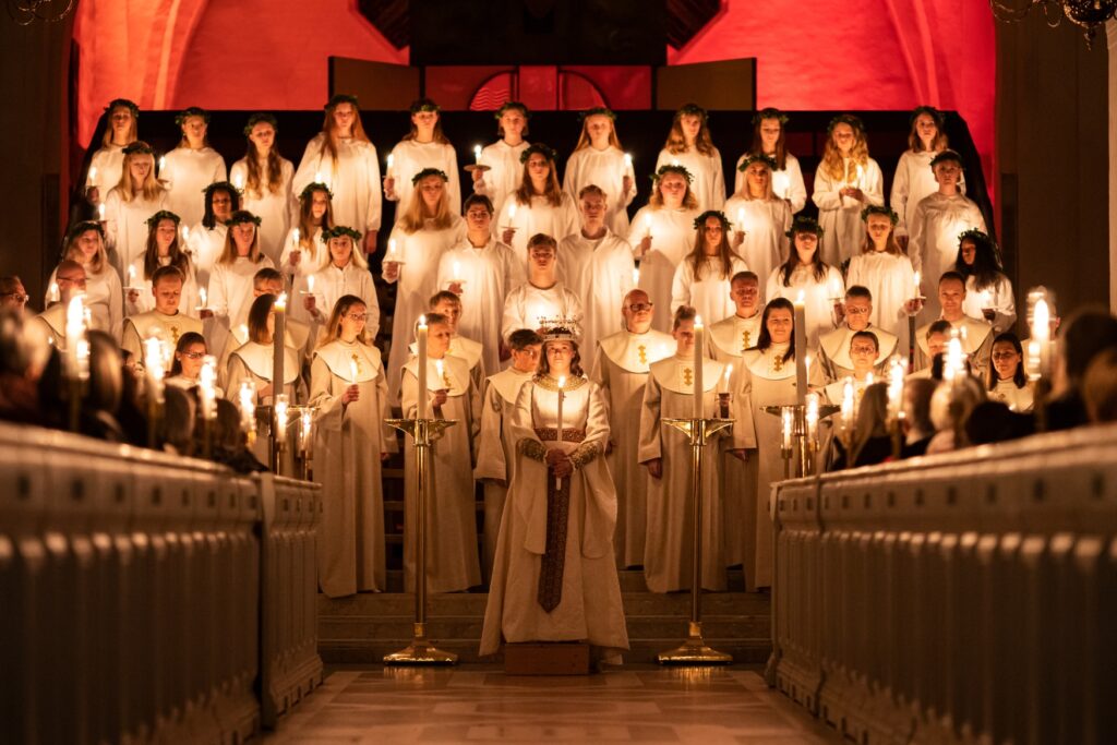 A Swedish Lucia choir, all holding candles