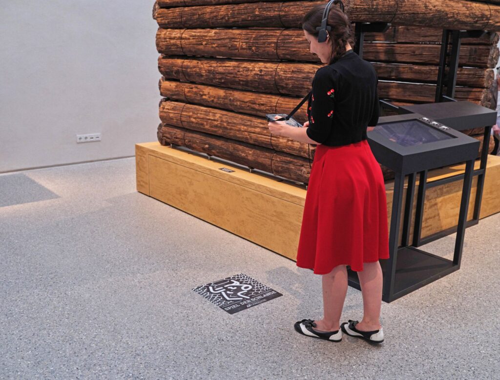 A visitor scans a code at the Archaeological Museum in Munich.