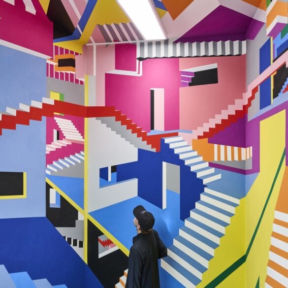 A colorful mural at the Wow Museum in Munich that resembles a drawing by M. C. Escher