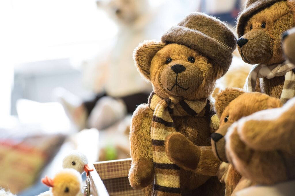 Several teddy bears in a box