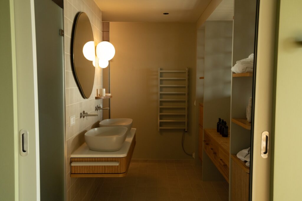 A bathroom with wooden interior in muted colors