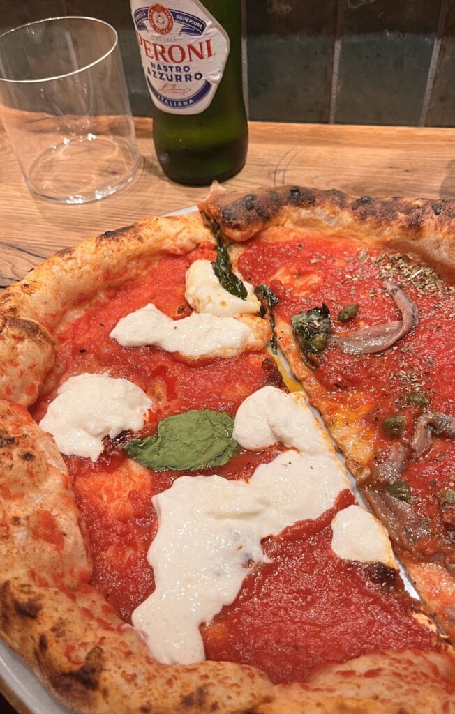 Pizza and beer in a pizzeria in Hamburg.