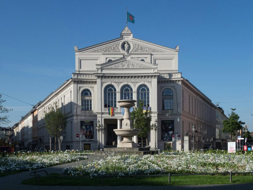 View of the bright white facade of the Gärtnerplatztheater in Munich's Glockenbachviertel