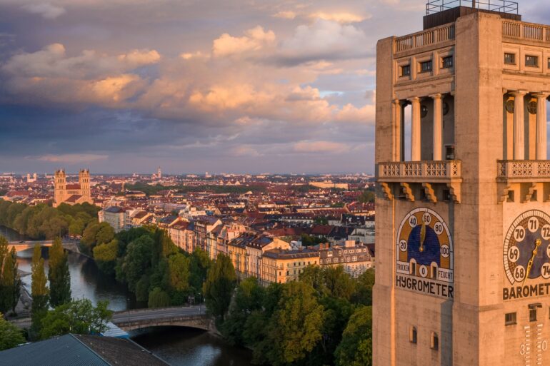 The tower of the Deutsches Museum, which was built on an island in the Isar. On the left side of the picture, on the banks of the Isar, you can see the Catholic Church of St. Maximilian.