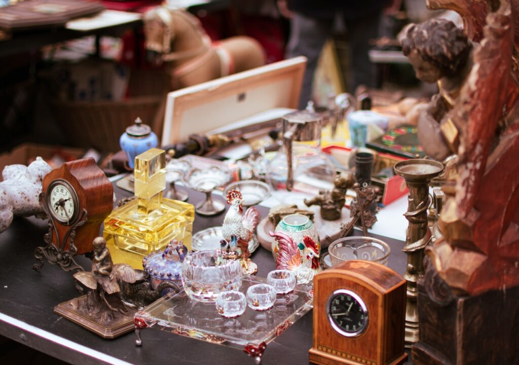 Several watches, glasses, and other items on a flea market table