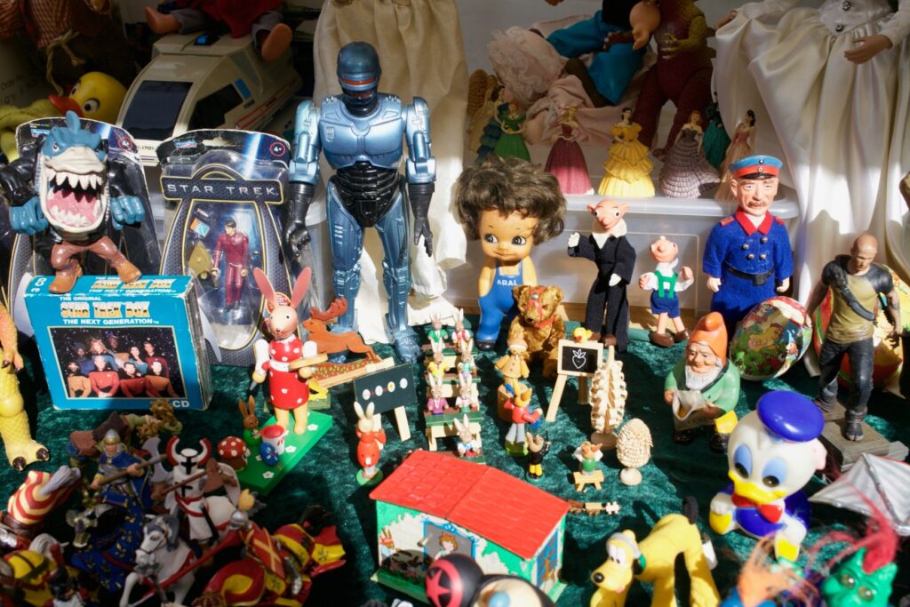 Numerous toys on a flea market table