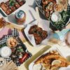 Eine Auswahl an verschiedenen Streetfood-Speisen auf einem Tisch