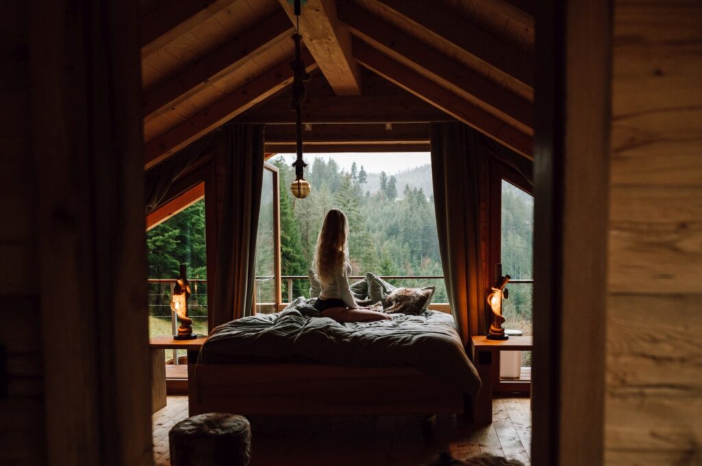 Four-poster bed in a wooden chalet Wooden heart at the Hilserhof near Triberg in the Black Forest