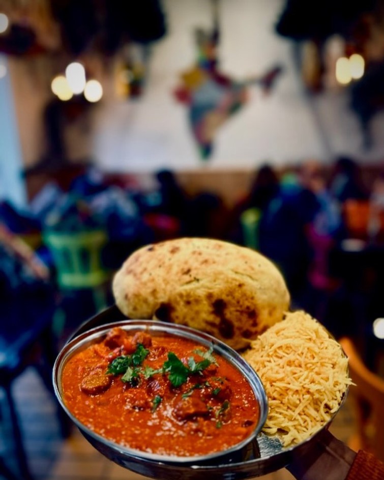 A plate of curry, rice, and naan at HaldiSpoon in Cologne-Mülheim