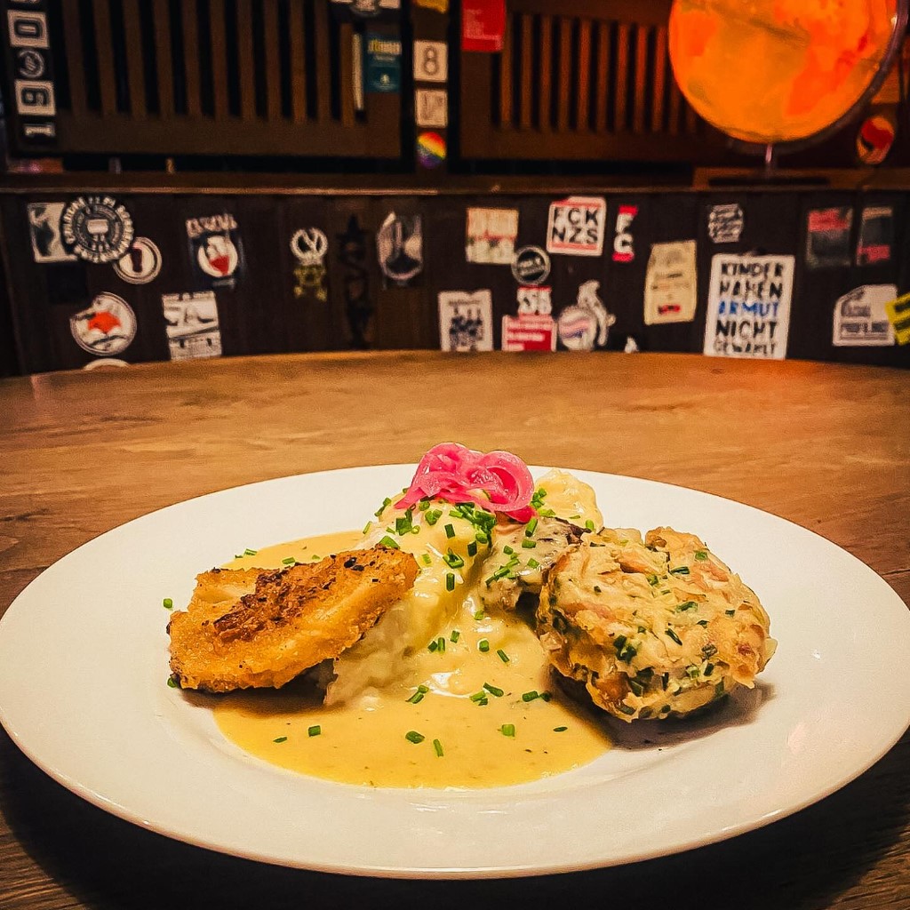 Two celery cutlets on a plate at Trash Chic in Cologne-Kalk