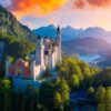 The Neuschwanstein Castle, with it's red front and it's many towers, perched on the slope of a mountain in the Alps. In the background is a valley with a lake and a small town, all around is a lush, green forest. Everything is illuminated by a golden and orange dawn.